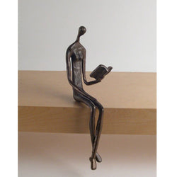 Woman Reading Over Ledge Cast Bronze Woman Reading Over Ledge Cast Bronze
