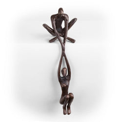 Man Lifting Woman from Ledge Bronze Sculpture Man Lifting Woman from Ledge Bronze Sculpture